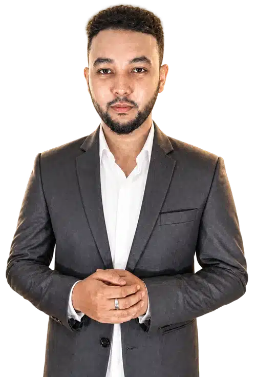Tusher Khondokar of WP BigBang, in a grey suit and white shirt, hands clasped